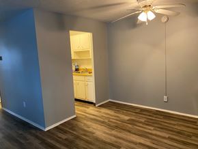 Berea apartment for rent - A room with a ceiling fan and a cabinet.